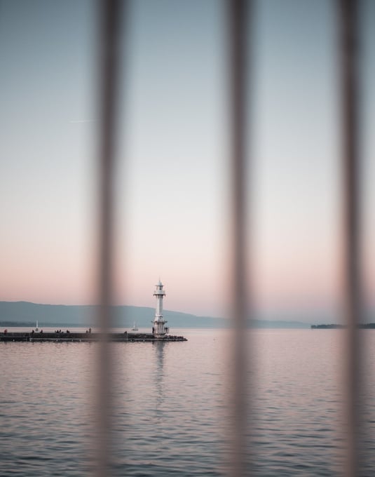 selective-focus-photo-of-lighthouse-beside-sea-2062547